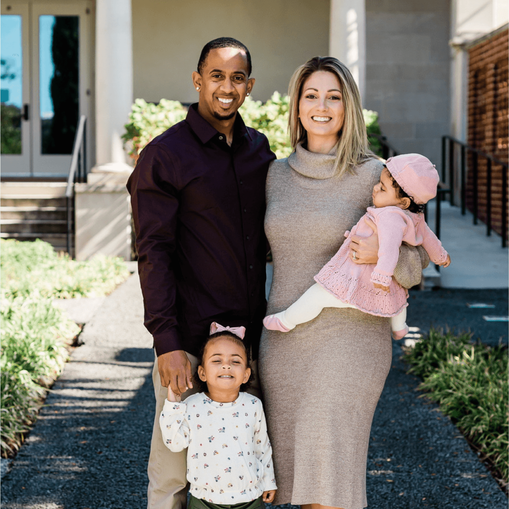 Tiffany Saunders poses with her husband and two daughters